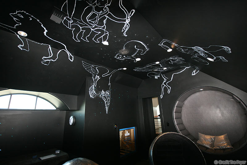 Photo of ceilings constellations painted with fluorescent paint by Tre Pryor