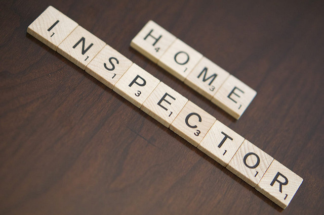 Home Inspector spelled out in tiles