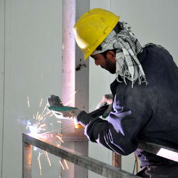 Photo of worker using steel in residential housing.