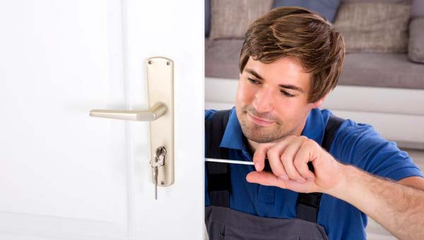 Photo of locksmith changing the locks - Your Ultimate Guide to Understanding Locksmith Services
