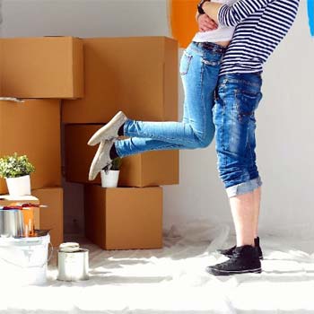Photo of couple hugging as they move in their new home