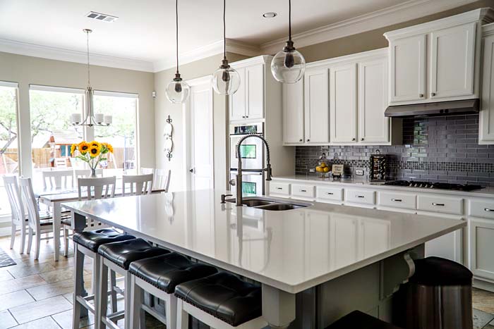 Photo of a renovated kitchen with white Shaker cabinets - Find Big Comfort with These 7 Louisville Home Improvement Projects