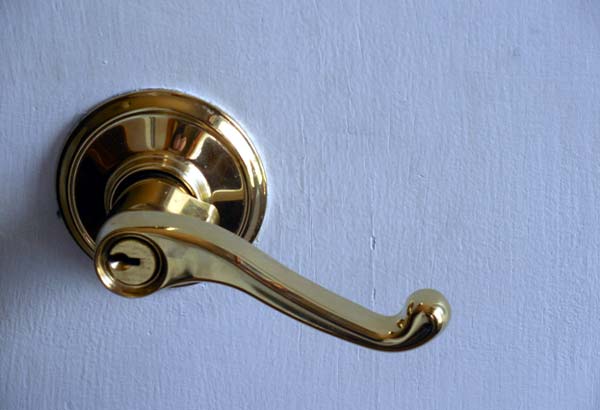 Photo of a lever door handle with lock