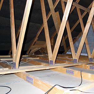 Photo of an attic with no insulation