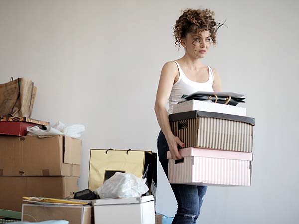 Photo of a woman moving boxes - Moving Made Simple: Your Ultimate Guide