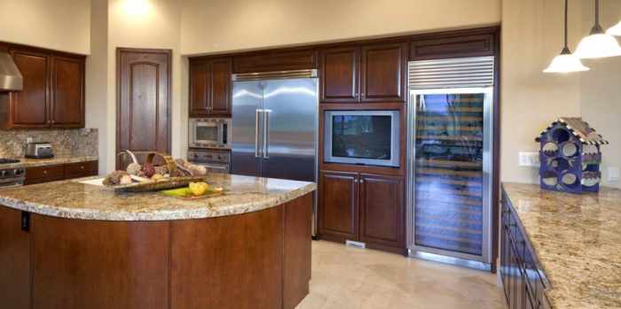 Photo of a kitchen makover with high end appliances