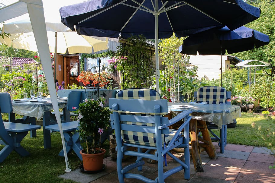 Photo of an outdoor space with patio furniture and umbrella