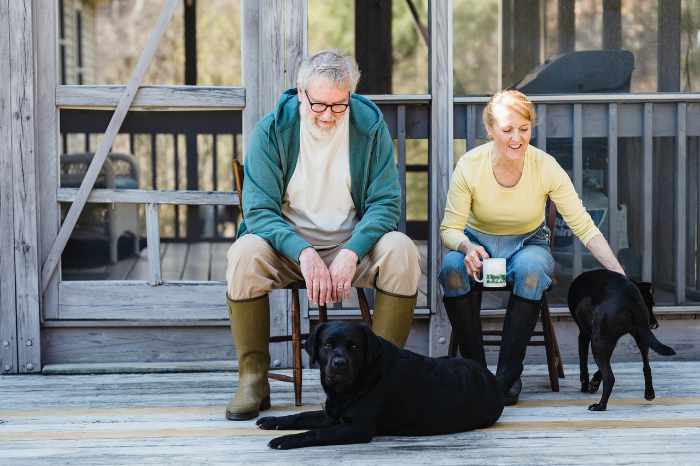 Photo of a mature couple enjoying their retirement in Kentucky with two black labs