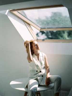 Photo of a room with a woman under a skylight