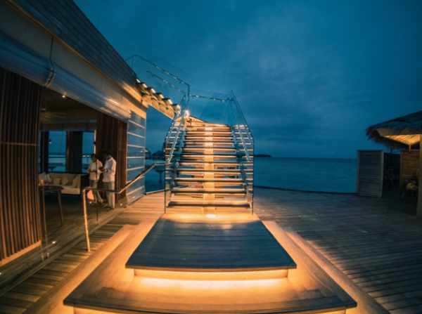 Photo of a vacation home with a lighted stairway