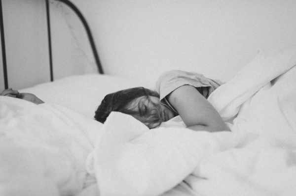 Photo of a woman sleeping in a bed