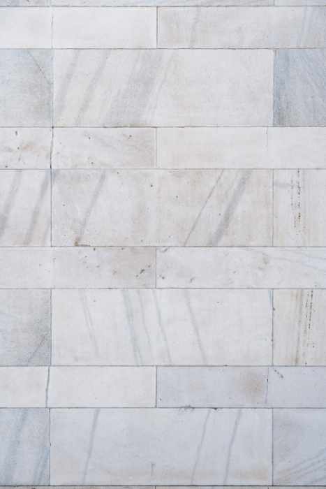 Photo of limestone tiles installed as flooring