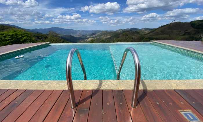 Photo of a swimming pool that overlooks mountains