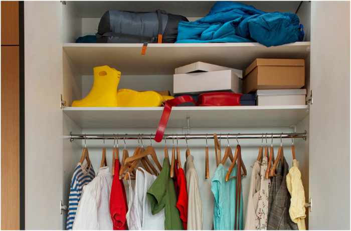 Photo of a fairly organized closet - The Hidden Cost of Clutter: How It Impacts Your Space And Finances