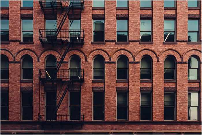 Photo of the outside of an apartment building - 5 Essential Apartment Considerations When Living Alone