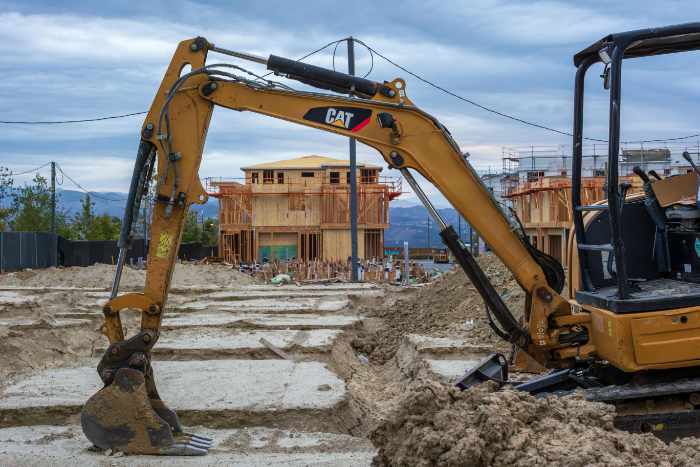 Photo of a excavating machine digging a basement for a house - Master the Craft: Essential Tips for Effective Excavation