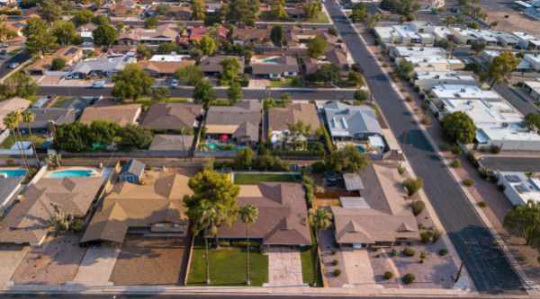 Aerial photograph of a neighborhood full of houses - How Suburban Living Influences Housing Market Trends