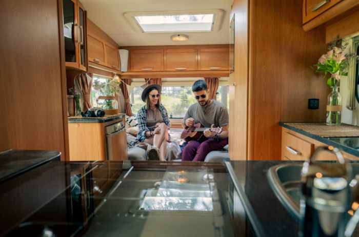 Photo of a couple in an RV or tiny house - Analyzing Mobile Home Market Trends