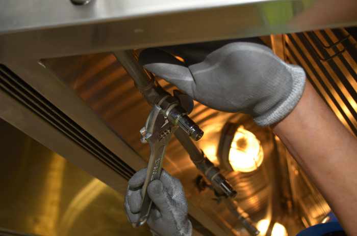 Photo of a plumber working on pipes - Homebuyers: Here's Your Plumbing Inspection Checklist
