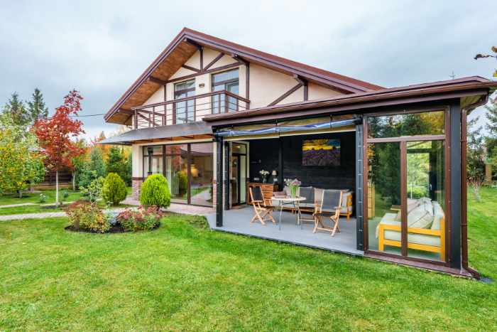 Photo of a home with a 3 season room - Exterior Features Buyers Notice Before They Walk Through the Door