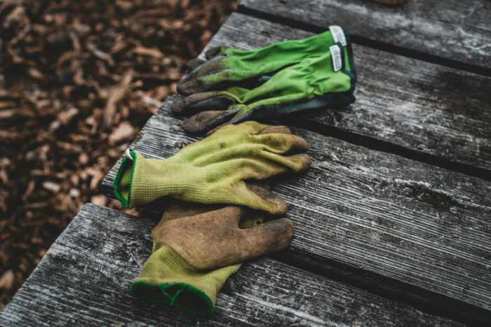 Photo of some work gloves on a deck - 7 Essential Garden Maintenance Tasks to Complete Before Listing Your Home