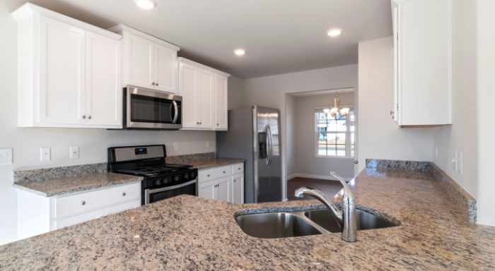Photo of a new kitchen with granite countertops - Quartz vs Granite Countertops: Which Adds More Value to Your Home