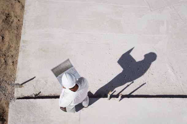Photo of a contractor with his laptop - Be Smart, Look for These 7 Contractor Red Flags