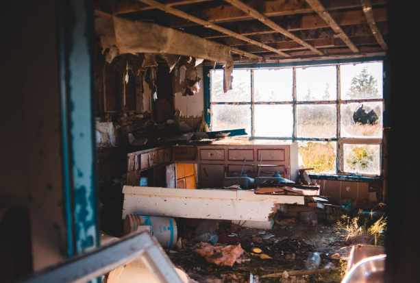 Photo of a destroyed room in a house - What to Do after Property Damage: First 48 Hours
